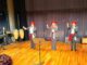 Estudiantes y músicos de la Casa Municipal de la Música durante su presentación en el Teatro del Lago de Frutillar.