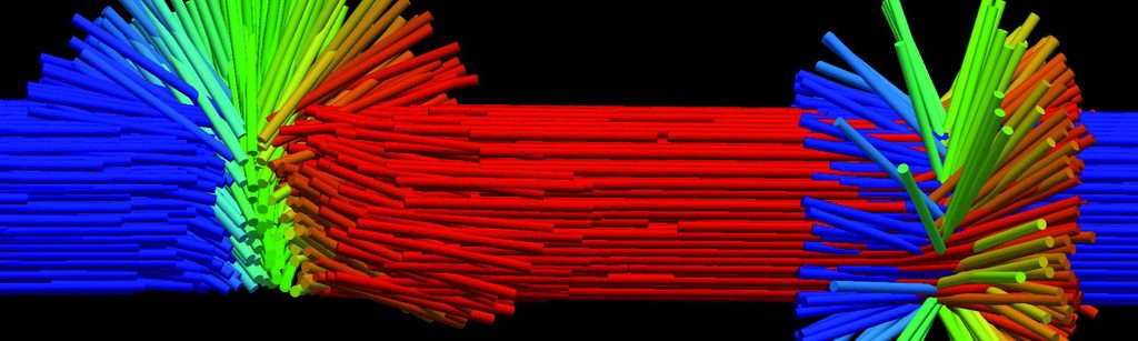 Exposición itinerante Imágenes del Nanomundo mostrando fotografías científicas a estudiantes en una escuela rural
