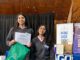 Estudiantes recibiendo reconocimiento en la II Feria de Ciencias Ambientales organizada por la Universidad de Los Lagos